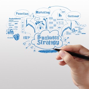 business man writing business strategy
